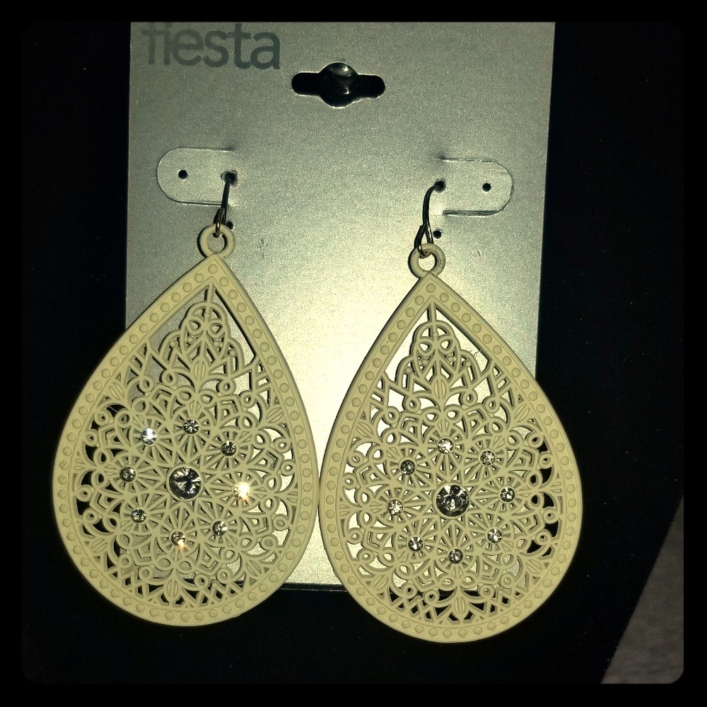 Cream and rhinestone dangle earrings.